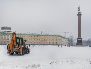 Snowplows in winter the city.

