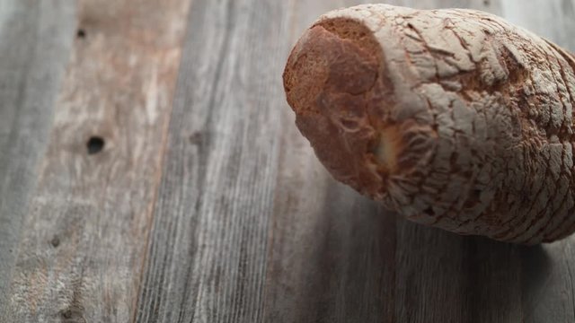 Sliced sourdough bread falling on a table. Shot with high speed camera, phantom flex 4K. Slow Motion.