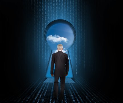 Doorway revealing cloudy sky with businessman looking