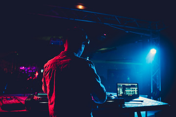DJ plays music on his deck in party