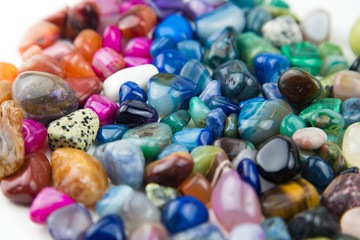 various tumbled bright coloured semi precious gemstones