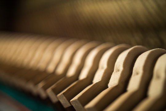 Inside an old piano - hammers and strings