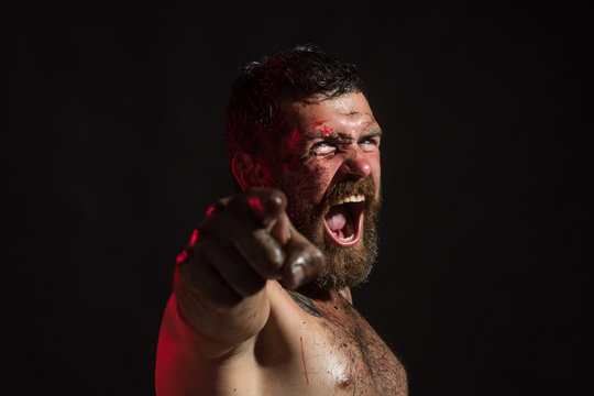 Man with bloody beard, angry face point finger