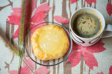 Cup of coffee and Toddy Palm Pie Pots on dish