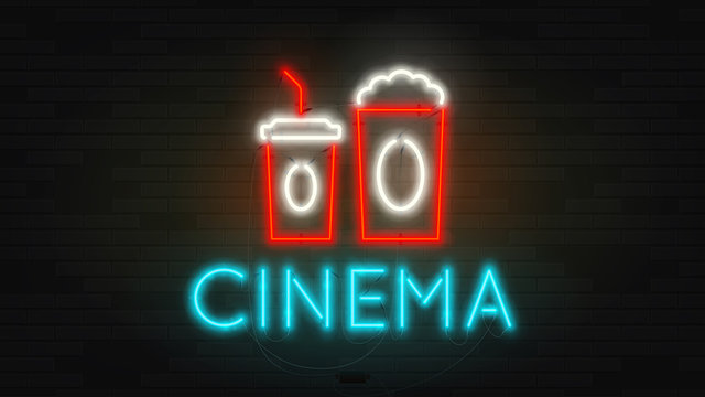 Realistic neon cinema billboard template. Retro shining color banner on brick wall. Concept of advertising for movie theater with glowing text.