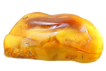 A large piece of amber is  amber texture. The background is yellow with waves of natural stone of fossil resin. Wavy volumetric texture of a sunstone. Macro. Microcracks in amber white background