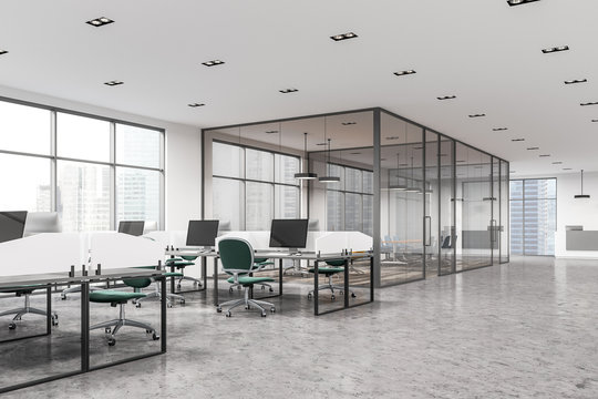 Open space office with green chairs, meeting room
