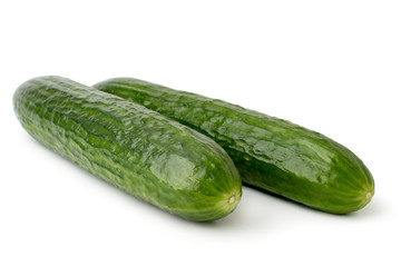 Two cucumbers on a white background.