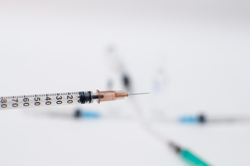 Plastic syringe insulin with needle on white background