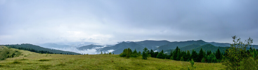 Amazing panorama on the mountain Yavorinka in the Carpathians during the rain © niko_cingaryuk