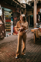 Fototapeta premium Young female tourist in a Muslim neighborhood