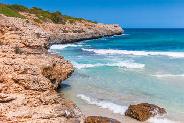 Fototapeta na wymiar Turquoise sea at the rocky coast of the Spanish island of Mallorca, Europe.