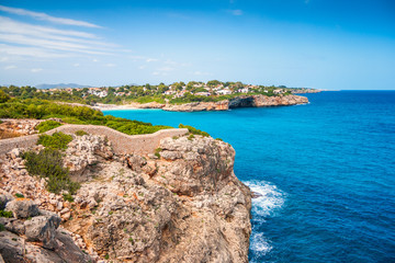 Turquoise sea at the rocky coast of the Spanish island of Mallorca, Europe.