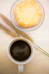 Closed up Cup of coffee and Toddy Palm Pie Pots on dish