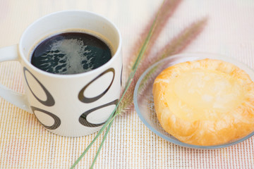 Closed up Cup of coffee and Toddy Palm Pie Pots on dish