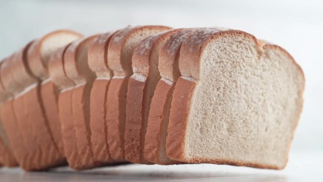Sliced white bread falling. Shot with high speed camera, phantom flex 4K. Slow Motion.