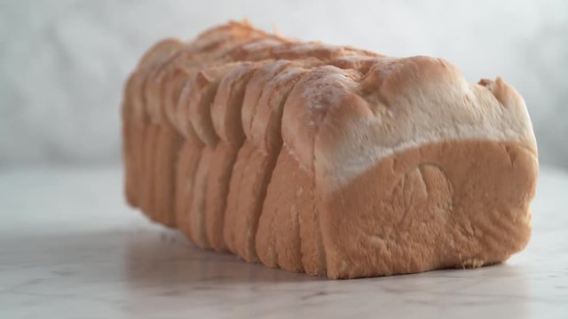 Sliced white bread falling. Shot with high speed camera, phantom flex 4K. Slow Motion.