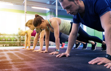 group of people exercising in gym