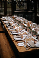 Set tables for fancy dinner in a green house