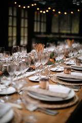 Set tables for fancy dinner in a green house