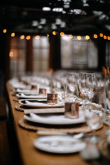 Set tables for fancy dinner in a green house