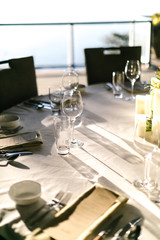 shadows of wine glasses on a set table