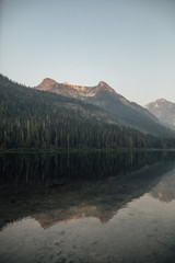 sunrise at reflecting mountain lake