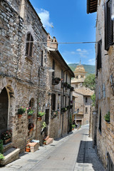 Traditional italian medieval alley in the historic center of beautiful little town of Spello Perugia , in Umbria region - central Italy