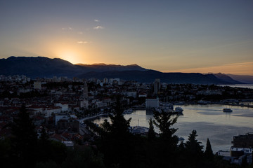 Scenic view of Split's historic Old Town and beyond from above in Croatia at sunrise. Copy space.