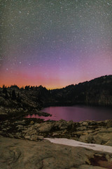 Fototapeta na wymiar northern lights above mountain lake