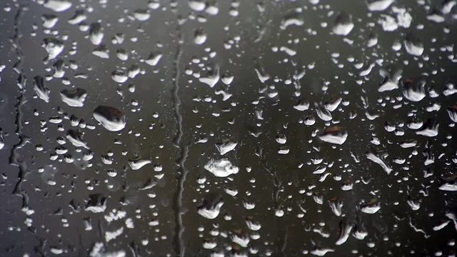 Drops Of Rain falling On Window on a rainy day