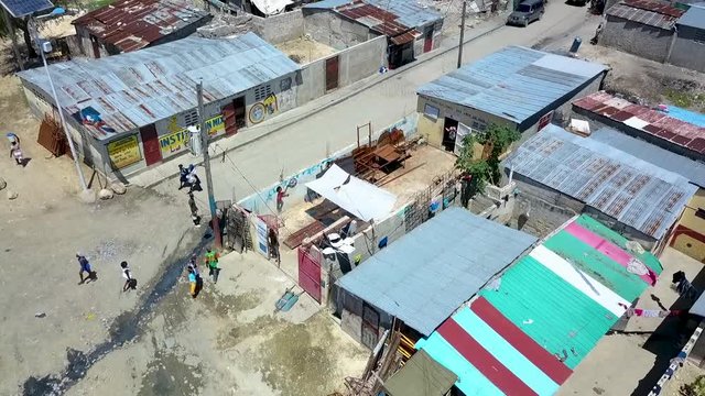 Drone footage rising above a slum in Port au Prince