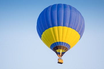 Colorful of hot air balloon with fire and blue sky background