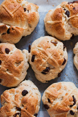 Homemade Hot Cross buns, spiced sweet buns with raisins and cross on top, traditionally eaten in the UK and other Christian countries for easter celebrations on Good Friday after lent