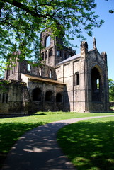 Fototapeta premium The ruins of Kirkstall Abbey in Leeds. The Abbey was left in ruins after the Disssolution of the Monasteries under King Henry VIII