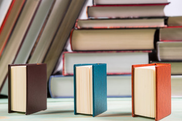 Pile of books on wooden background