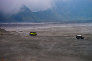 Fototapeta premium BROMO, INDONESIA - 2ND MAC 2014 - A classic and easiest way to do Bromo Tengger Semeru National Park was by jeep ride. Just sit on jeep along the way go roaming the misty fog at Pasir Berbisik.