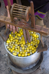 Boiling cocoon silkworm in the pot to make silk yarn
