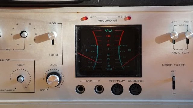 Pan right of controls on a Kenwood KW 5066 solid state stereo tape deck. Circa 1971 or 1972. Vu meters are moving.