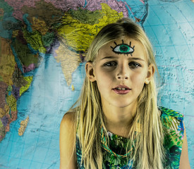 girl teenager  with a third eye on her forehead in the background of a world map