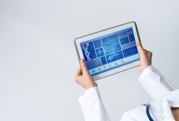 Close of female doctor hands working with tablet pc computer