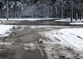 asphalt road in winter with snow