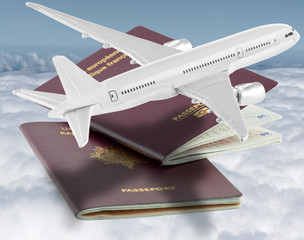 avion et passeports au-dessus d'une mer de nuages