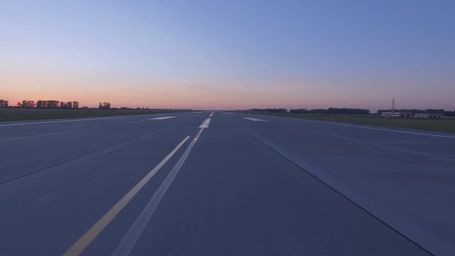 Airplane accelerates over the runway - POV
