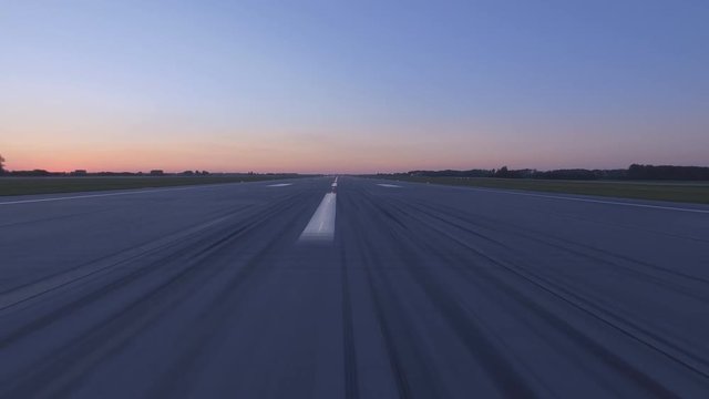 Airplane accelerates over the runway - POV