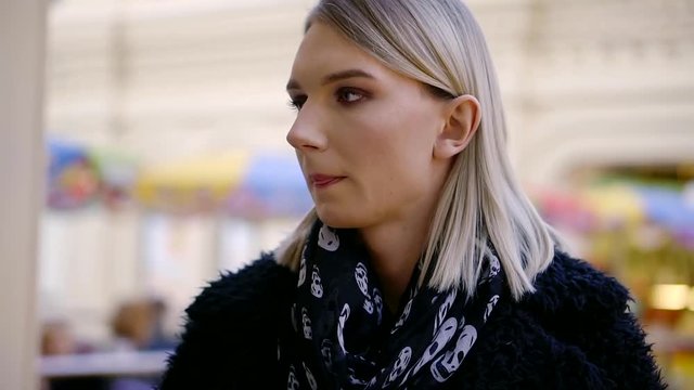 a portrait of a transsexual or metrosexual with a piling on the head, who looks around