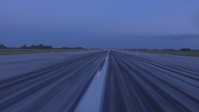 Airplane accelerates over the runway - POV