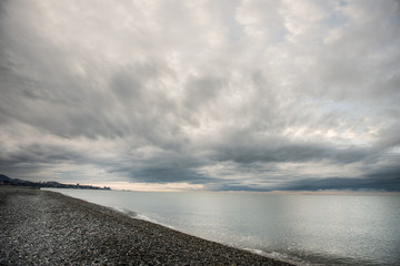 Sea harbour skyline from a distance enlighted by sunbeams