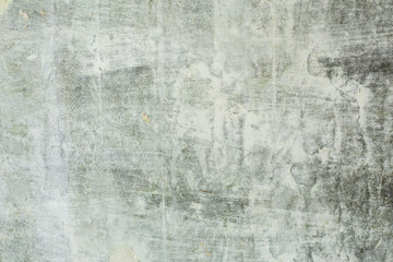 Old gray concrete wall with scuffs and putty green primer, texture background