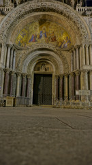 Religious painting on the front door of St. Marco Church, Venice Italy